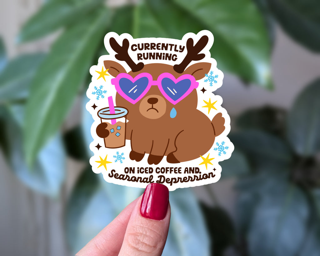 Currently Running on Iced Coffee and Seasonal Depression – Funny Winter Mental Health Sticker, Cute Reindeer Vinyl Sticker