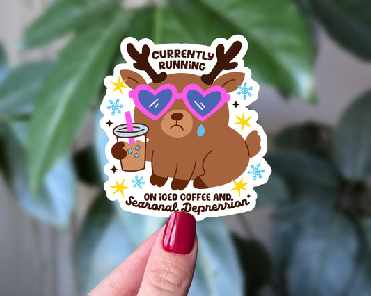 Currently Running on Iced Coffee and Seasonal Depression – Funny Winter Mental Health Sticker, Cute Reindeer Vinyl Sticker